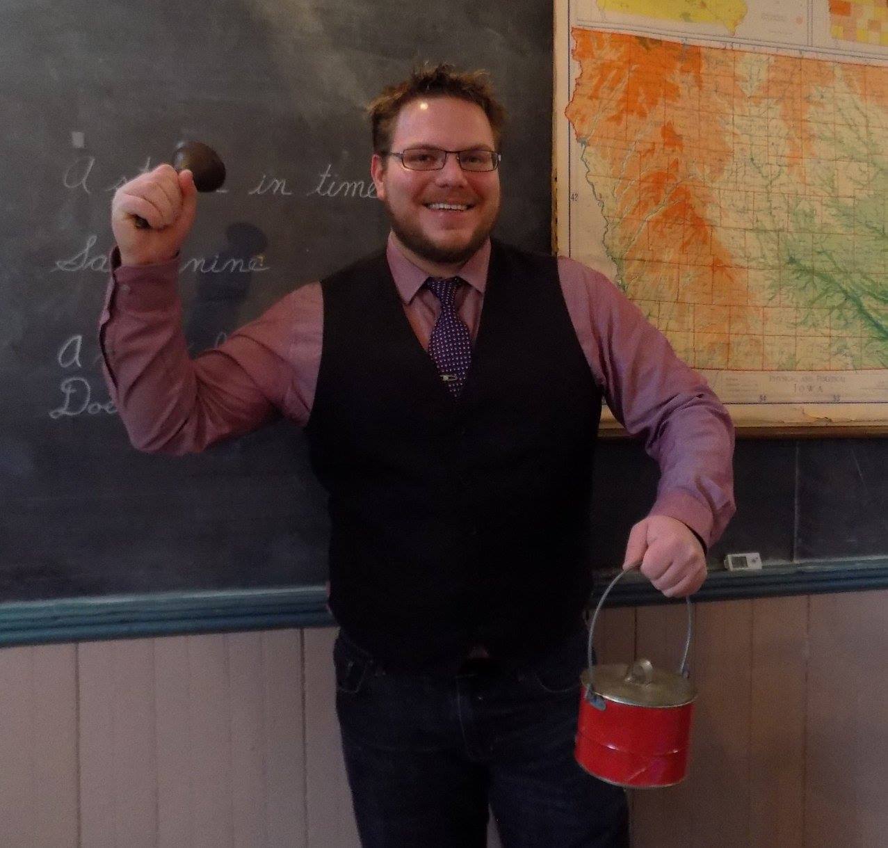 Nathan Arndt holding a bell and a bucket